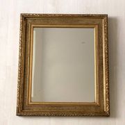 Small wooden mirror with gilded stucco in the Louis XVI style.