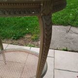 Old oval table with marble top, Louis XVI style