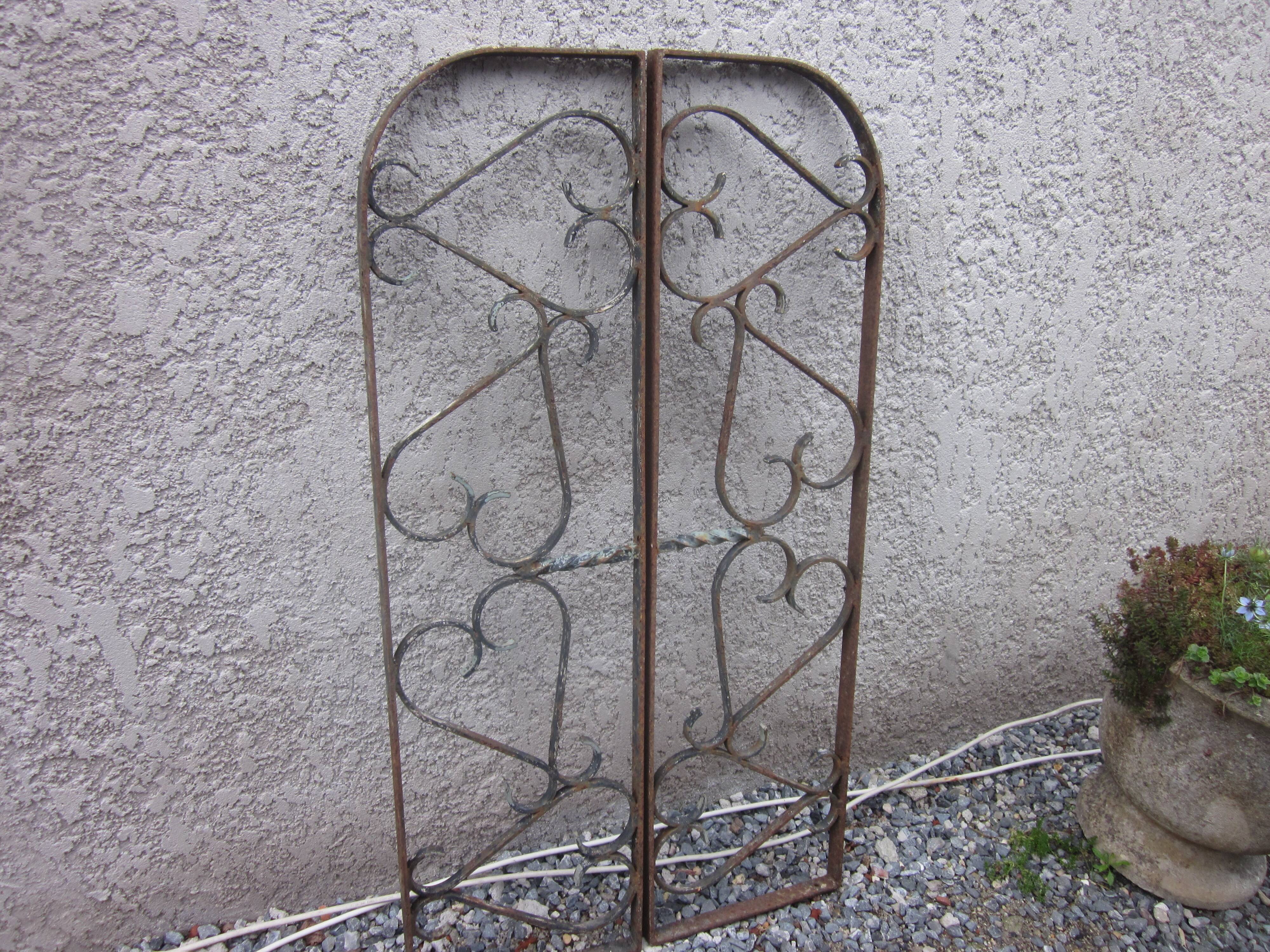 Pair of old wrought iron grid