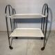 Vintage folding dessert table in chrome metal with enamelled trays.