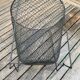 Foldable black woven metal wastepaper basket from around 1950.
