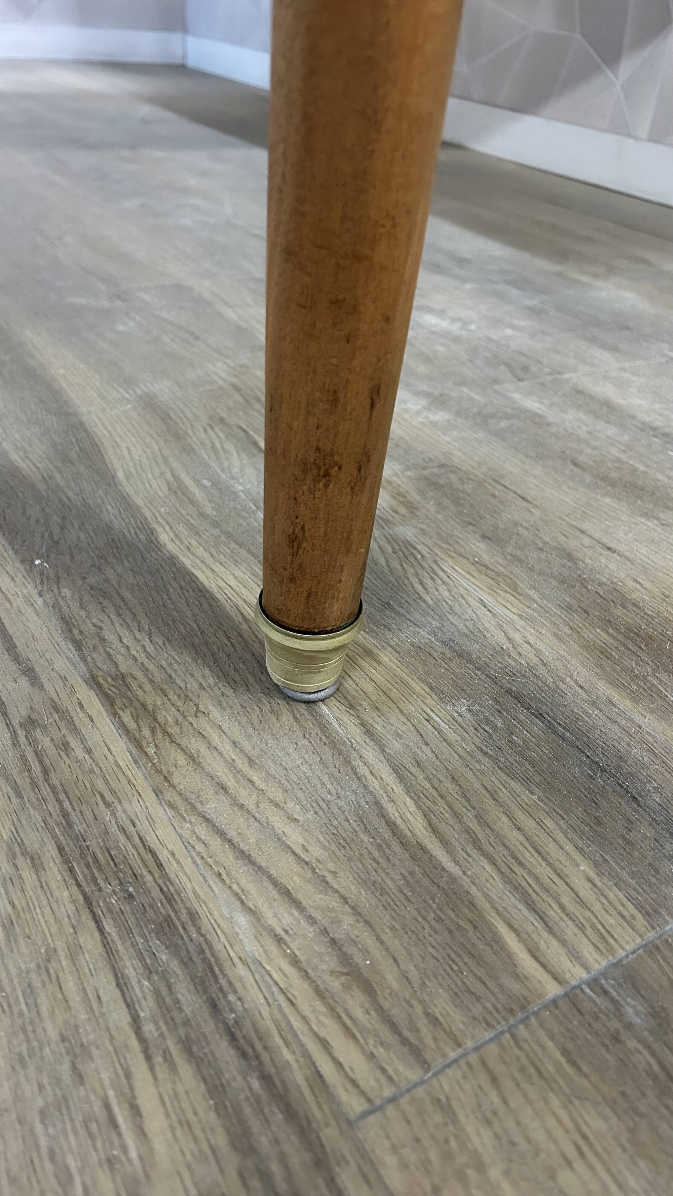 Dining table with tapered legs and solid exotic wood