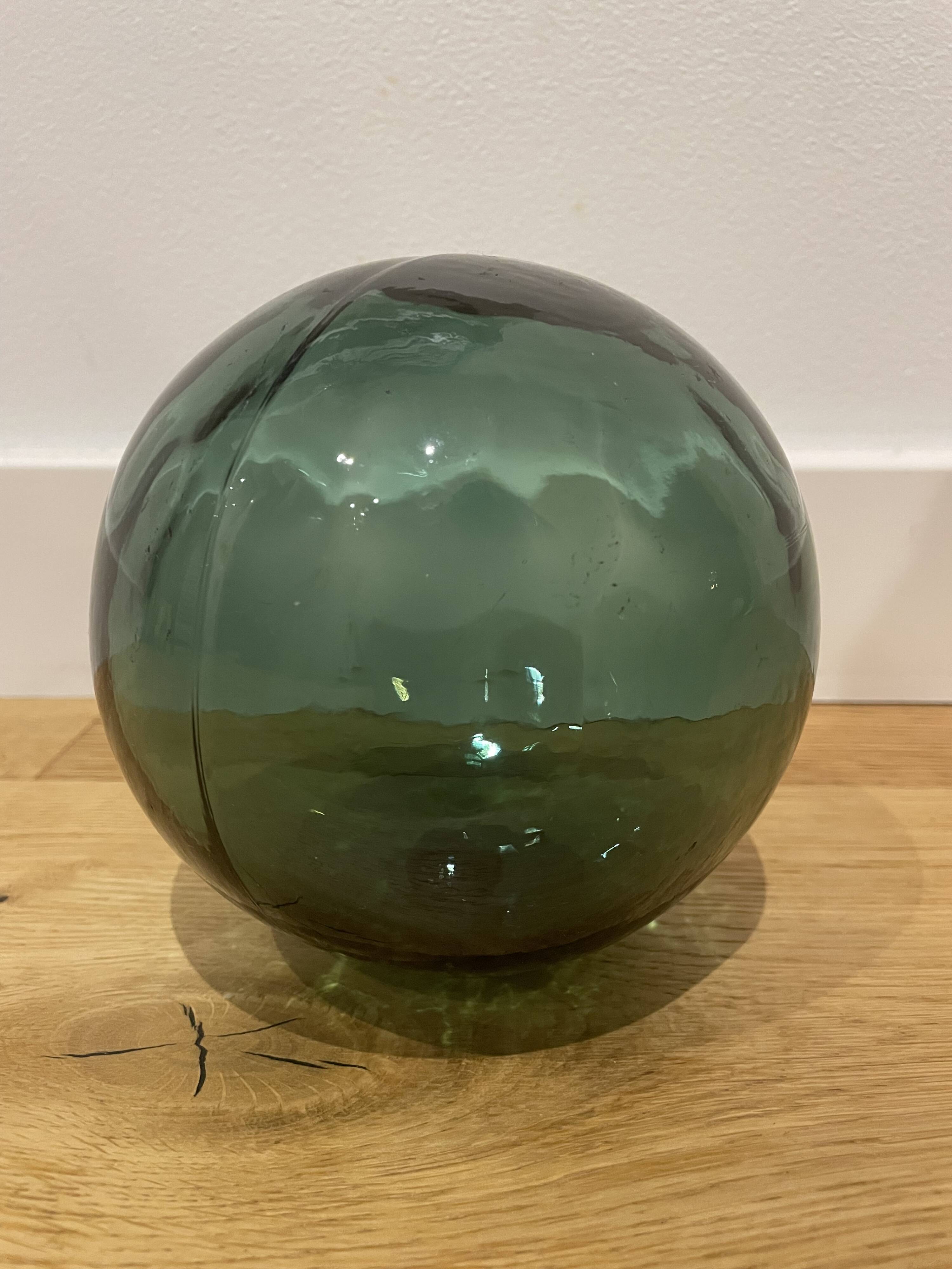 Floating fishing ball in glass