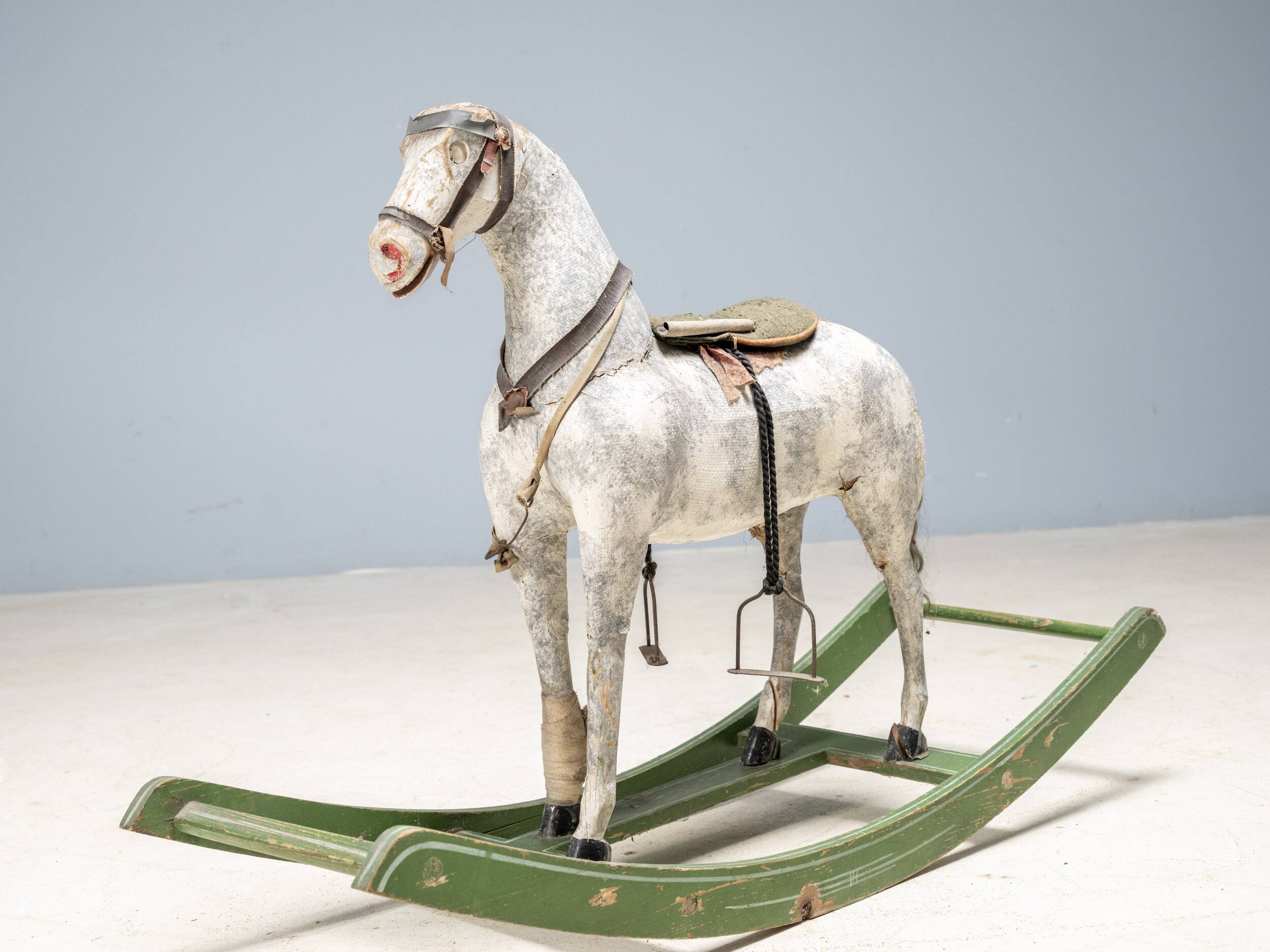 Antique wooden rocking horse, vintage toy with original patina.