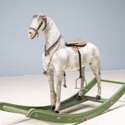Antique wooden rocking horse, vintage toy with original patina.