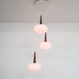 Set of three milk glass and teak pendant lights model NG74 by Louis Kalff for Philips, The Netherlan