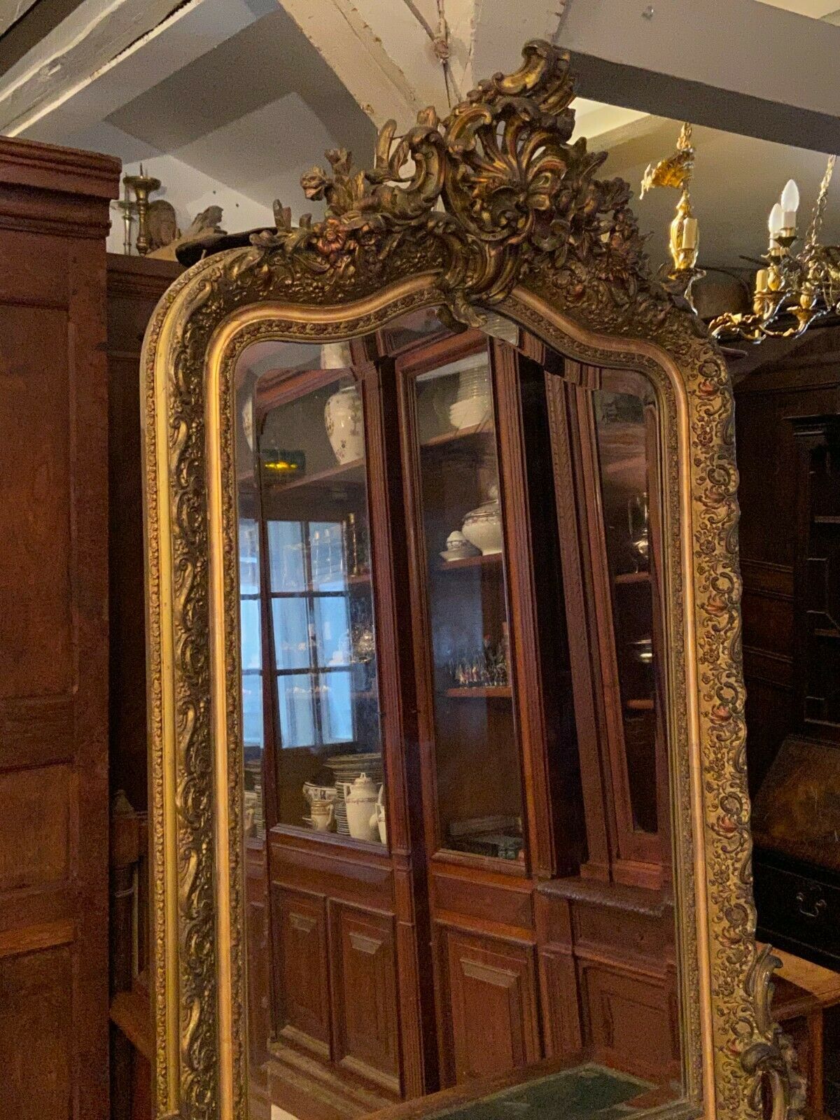 Golden mirror with bevelled ice pediment in Regency style