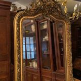 Golden mirror with bevelled ice pediment in Regency style