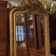 Golden mirror with bevelled ice pediment in Regency style