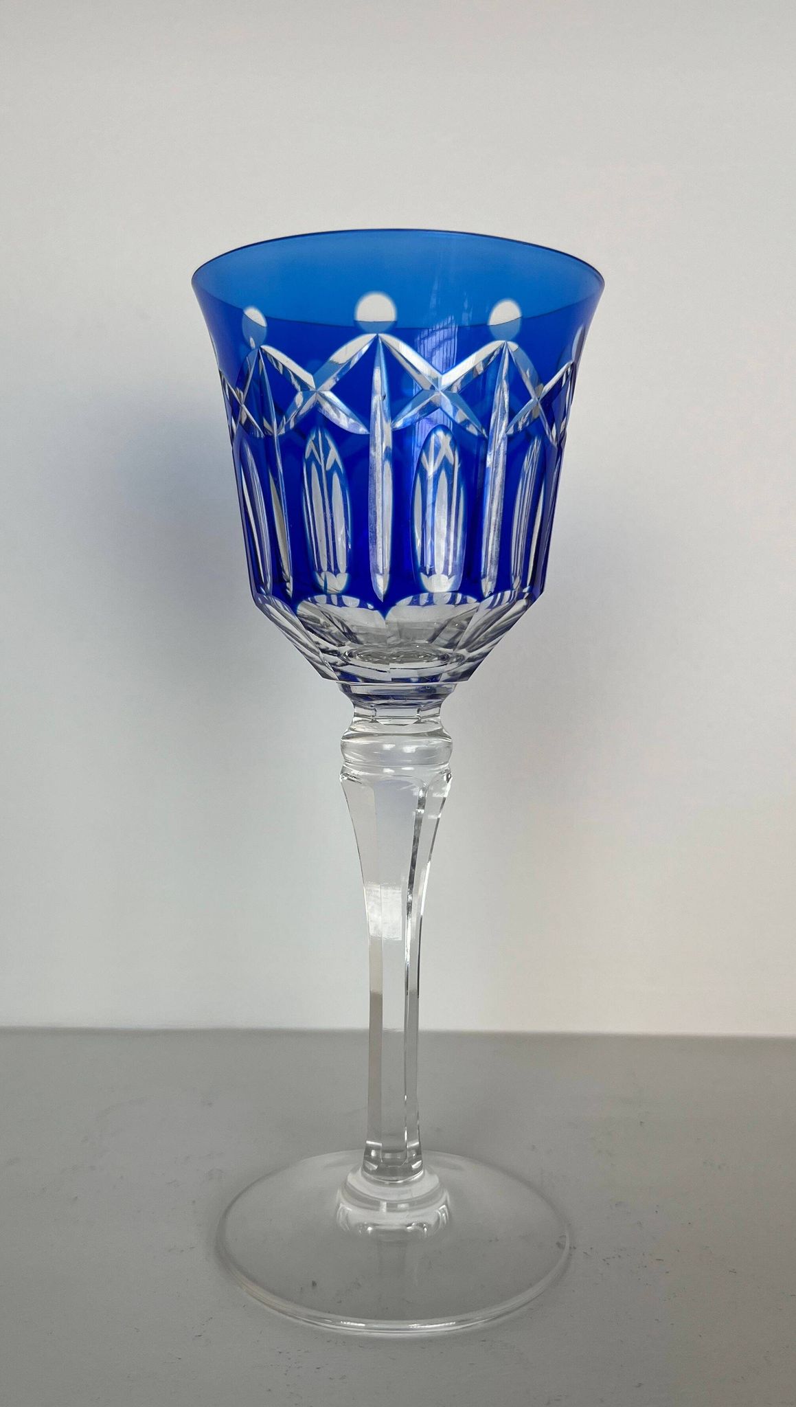 Set of twelve glasses in crystal tinted in different colours and cut with stars.