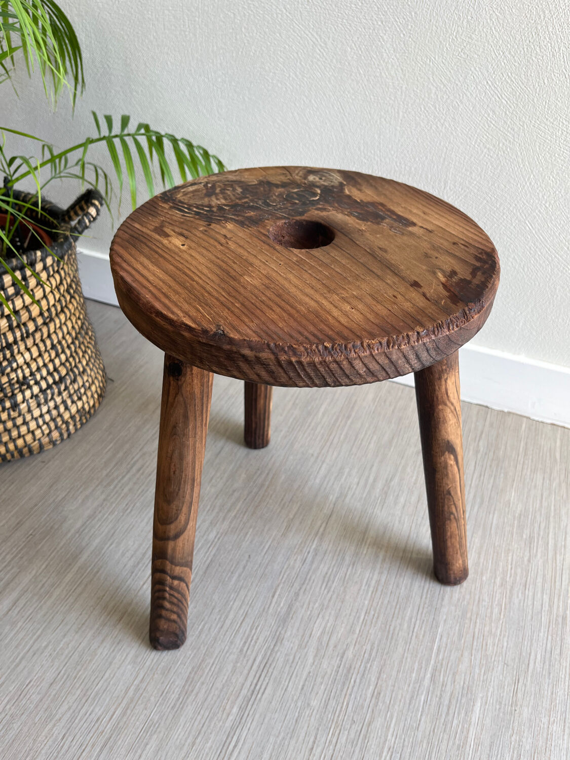 Three-legged wooden stool