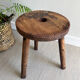 Three-legged wooden stool