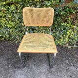 Wooden chair with caning in the style of Marcel Breuer.