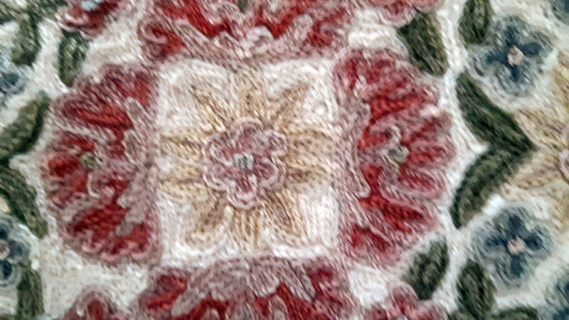 Set of three old hand-embroidered wool cushions
