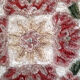 Set of three old hand-embroidered wool cushions