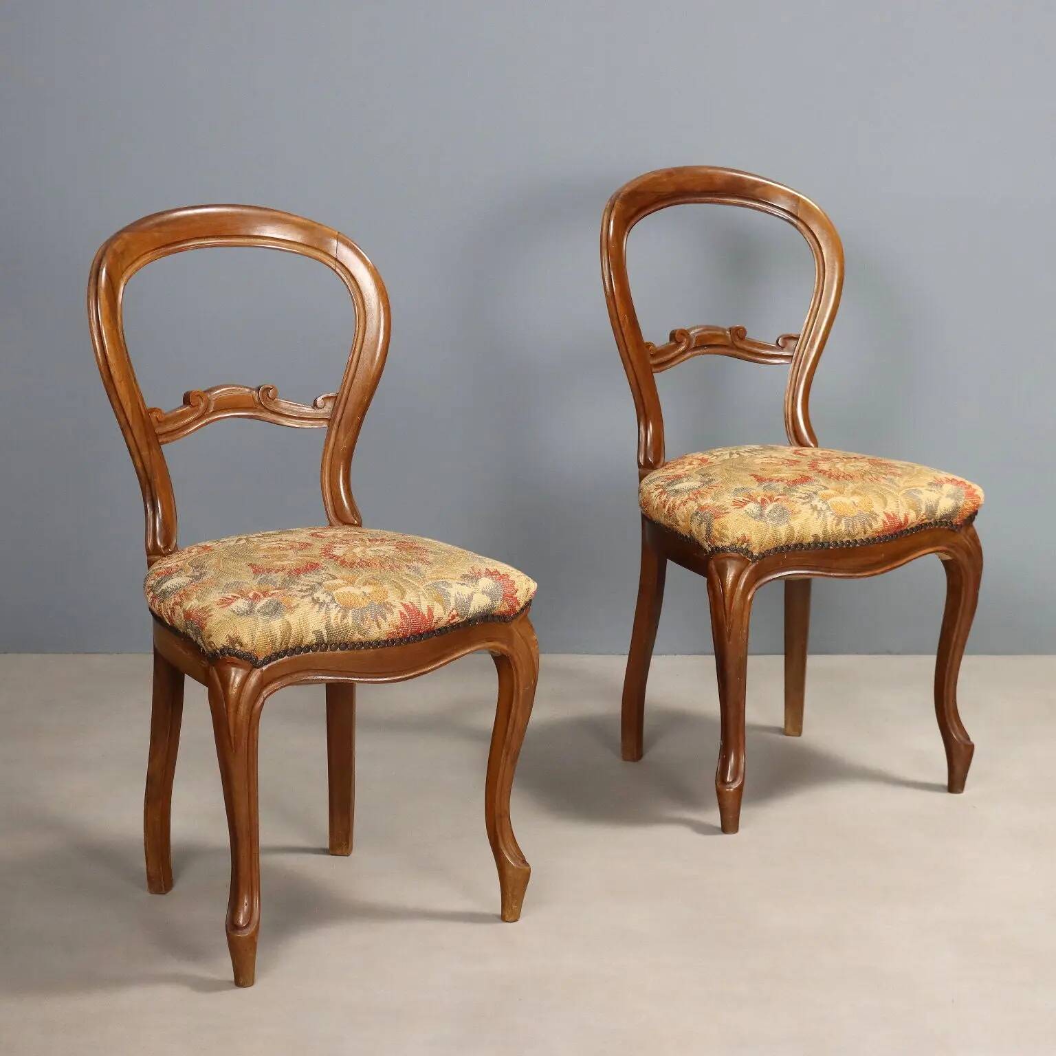 Pair of antique Louis-Philippe chairs in walnut and fabric, Italy, 19th century.