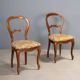 Pair of antique Louis-Philippe chairs in walnut and fabric, Italy, 19th century.