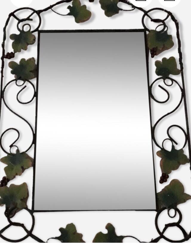 Vintage wrought iron mirror.