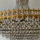 Chandelier cascade of tassels and brass