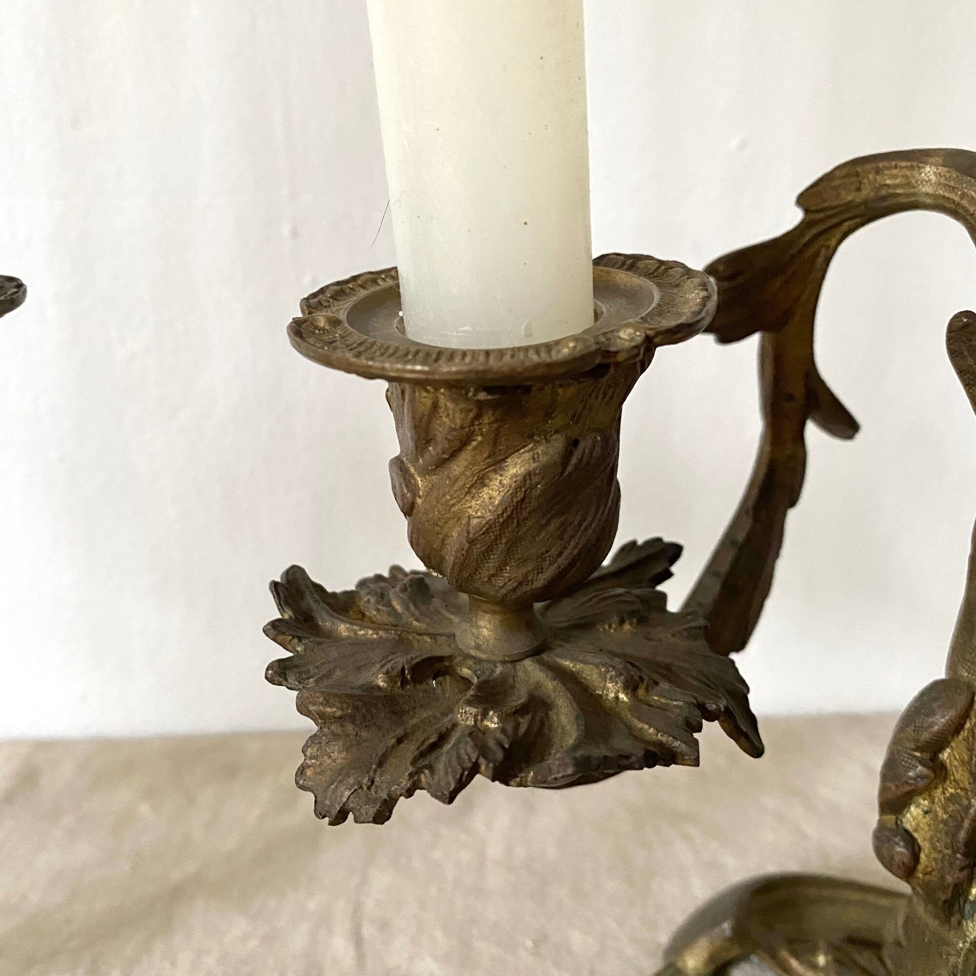 Pair of antique bronze candlesticks at the end of the table XIXth