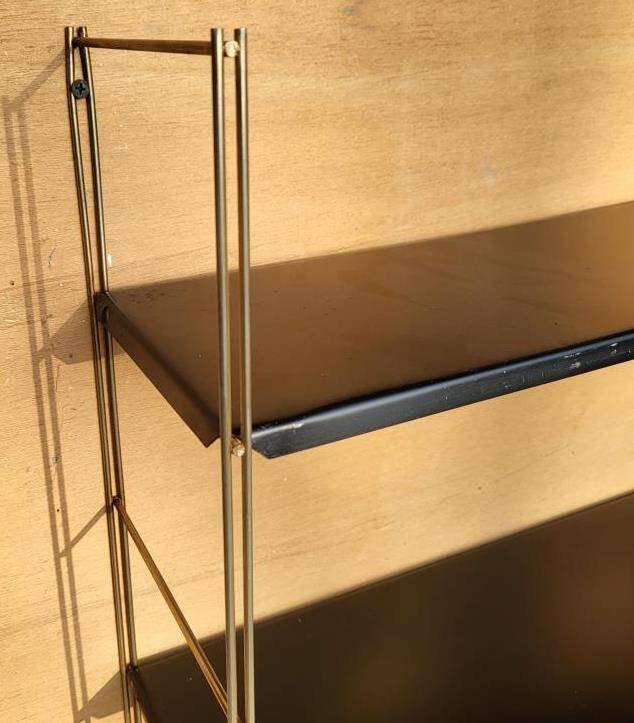 Tomado style black metal string shelf with gold ladder