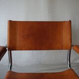Three  leather armchairs