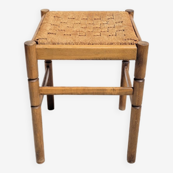 Low wooden stool and rope