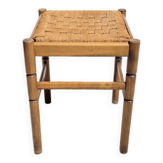 Low wooden stool and rope