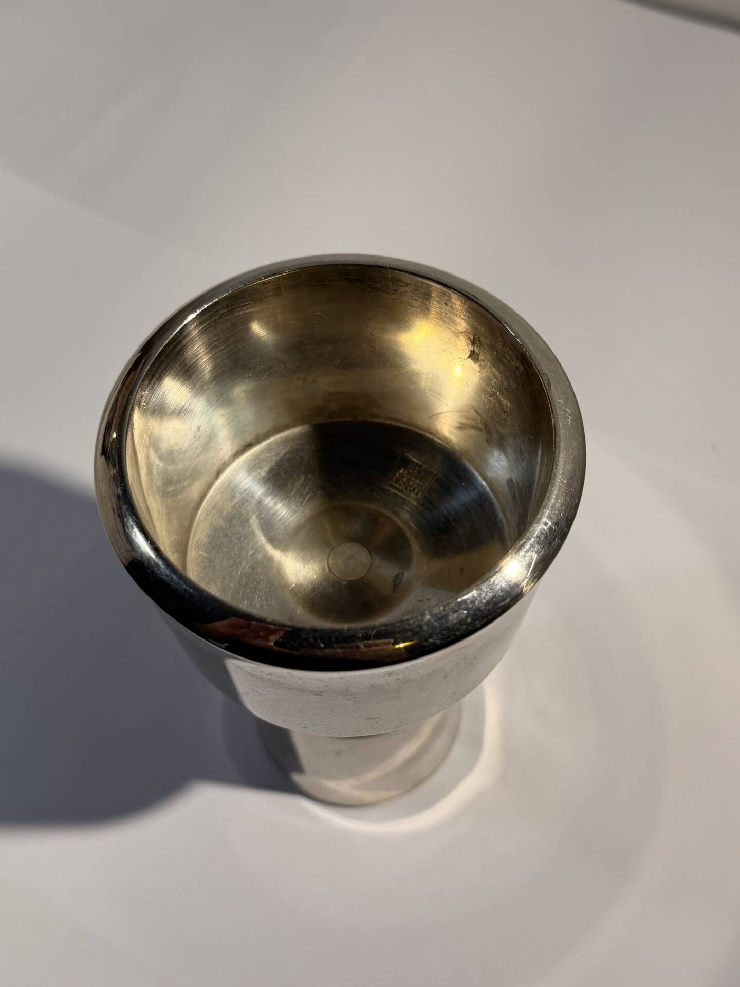 Metal candlestick by Jens Quistgaard for the brand Dansk Designs.