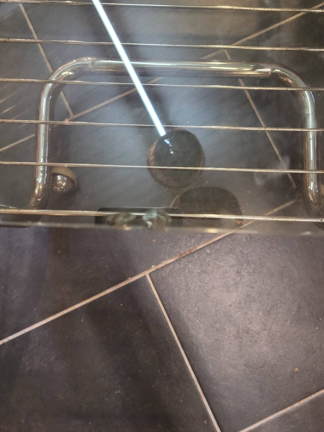 Coffee table with chrome base and smoked glass from the 70s