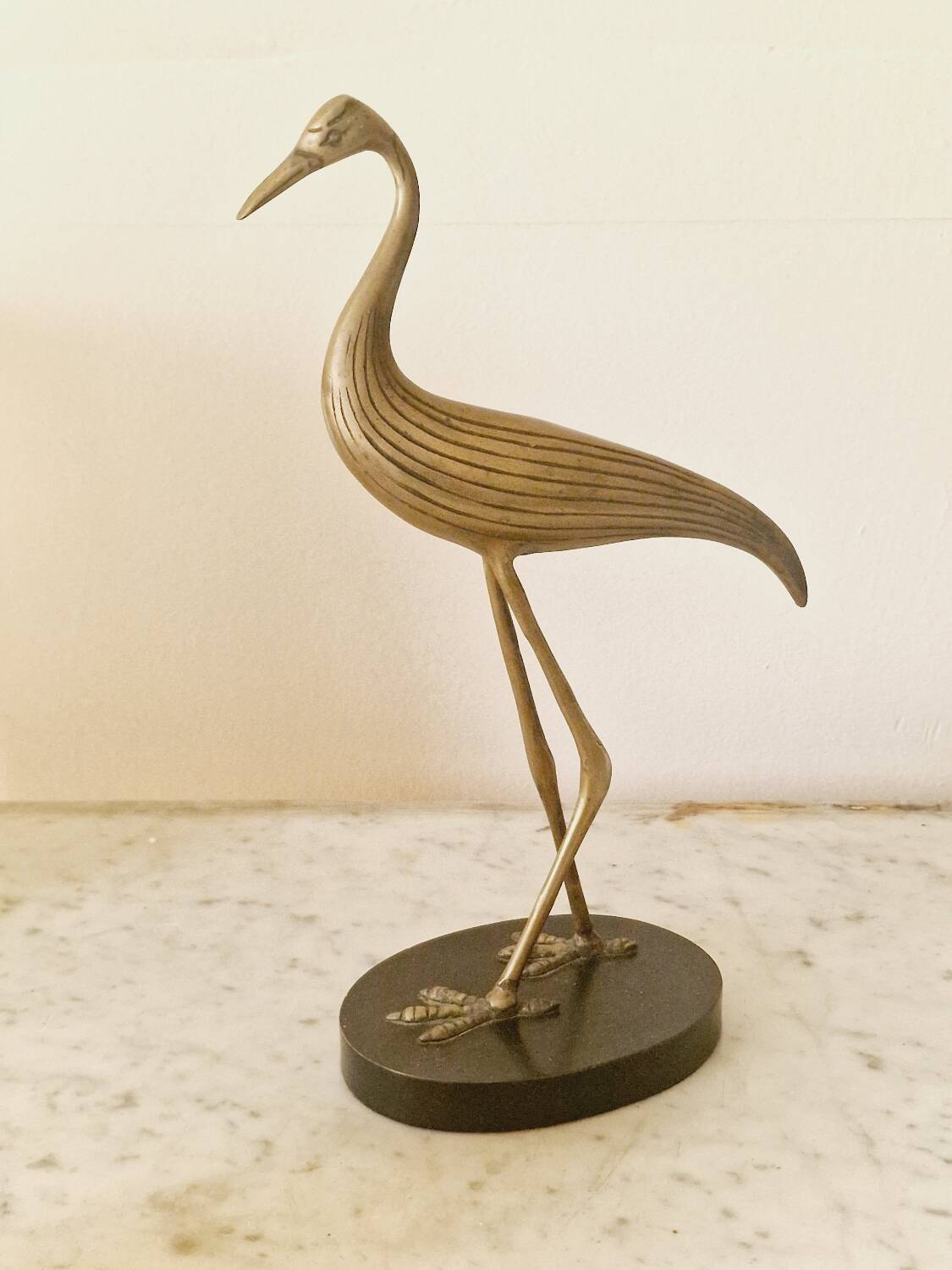 Vintage brass heron statue.