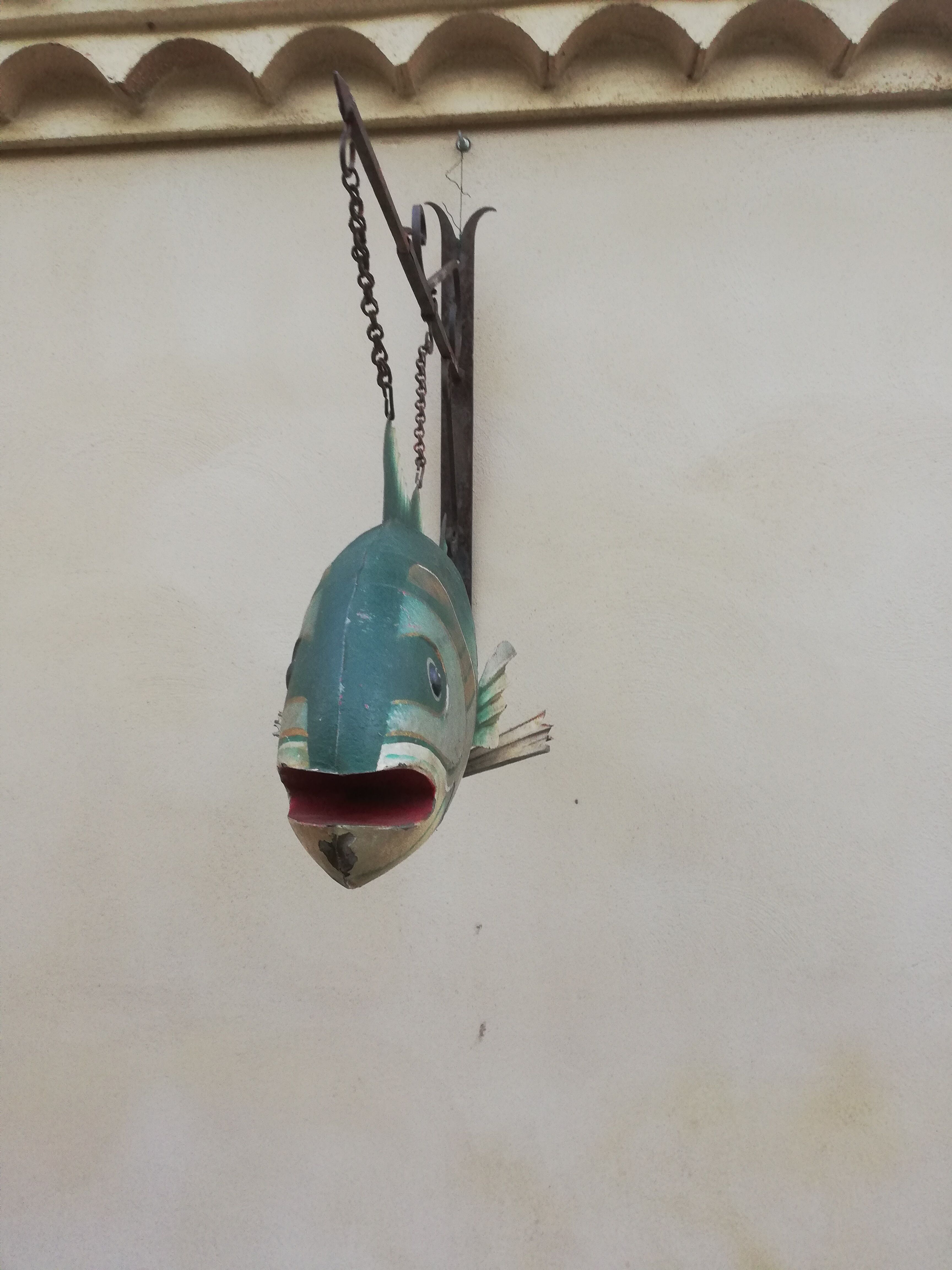 Panel depicting a fish in sheet metal