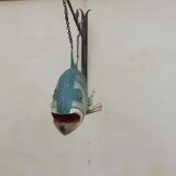 Panel depicting a fish in sheet metal