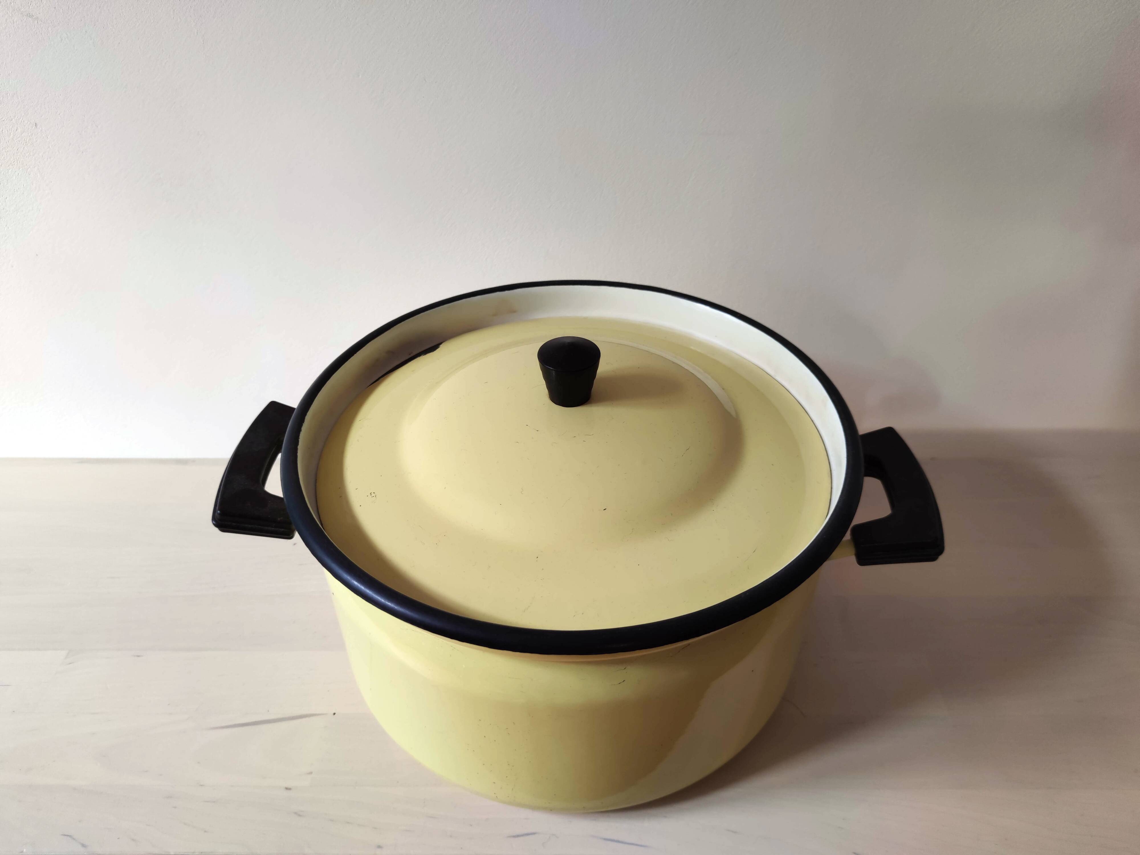 Bright yellow enameled metal stewpot - aubecq from the 1950s