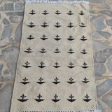 White and black carpet with berber patterns hand-woven in natural wool