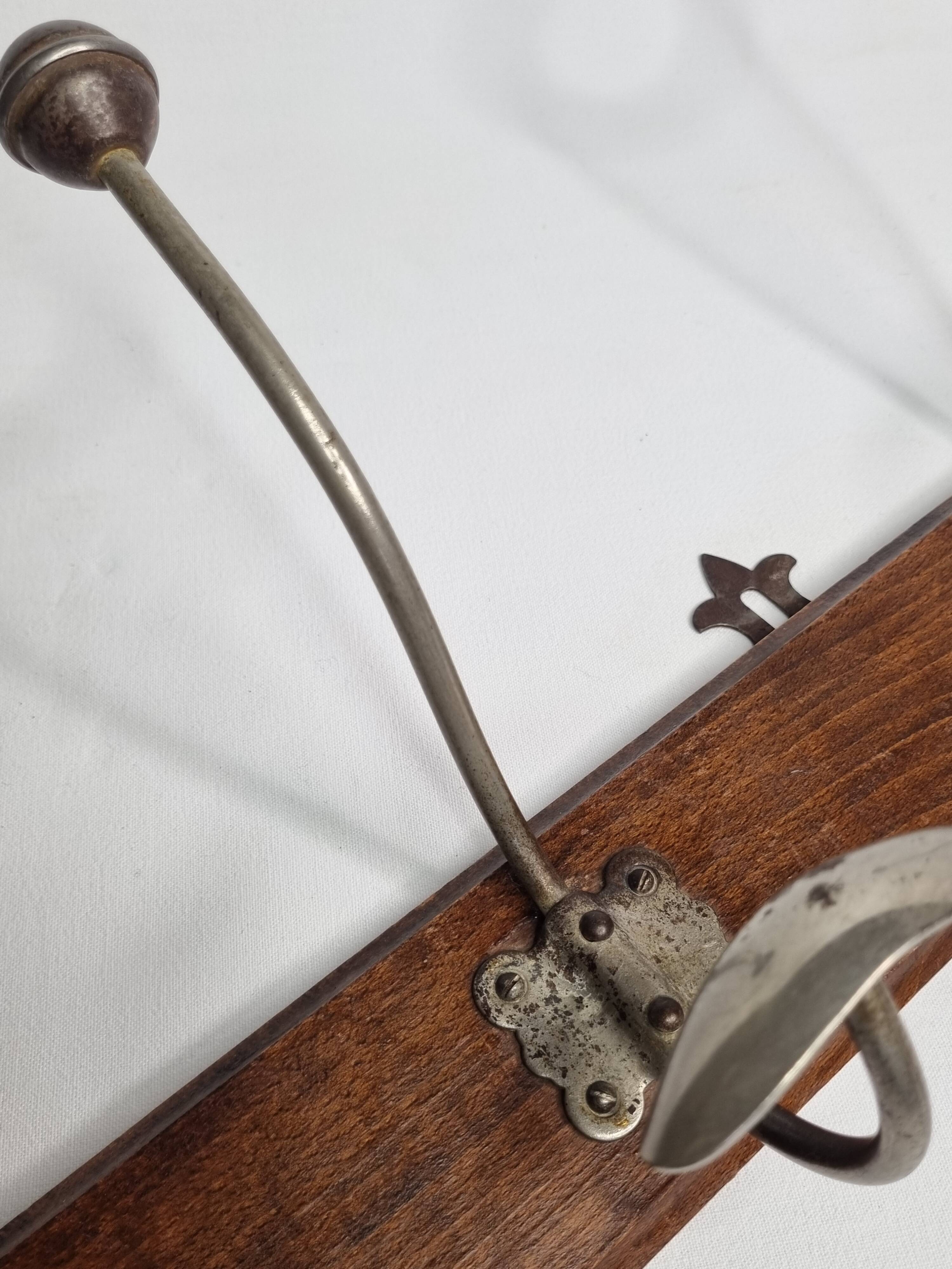 Antique wall-mounted coat rack in wood and metal with 4 hooks, 66 cm