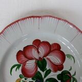 Old earthenware plate of the East Strasbourg decorated with flowers