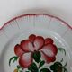 Old earthenware plate of the East Strasbourg decorated with flowers