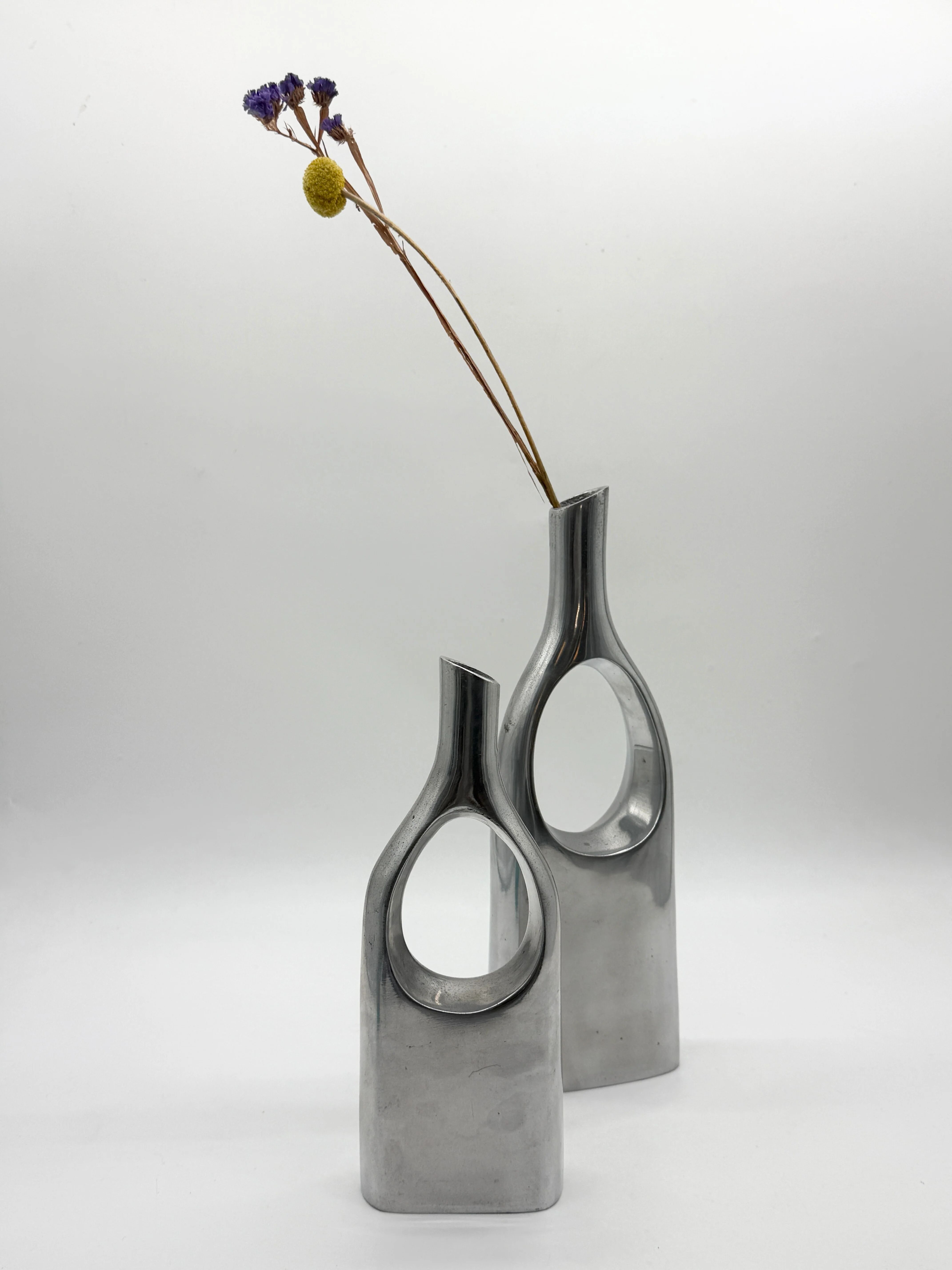 Pair of "drop" vases in aluminium cast, Italy, 1970s