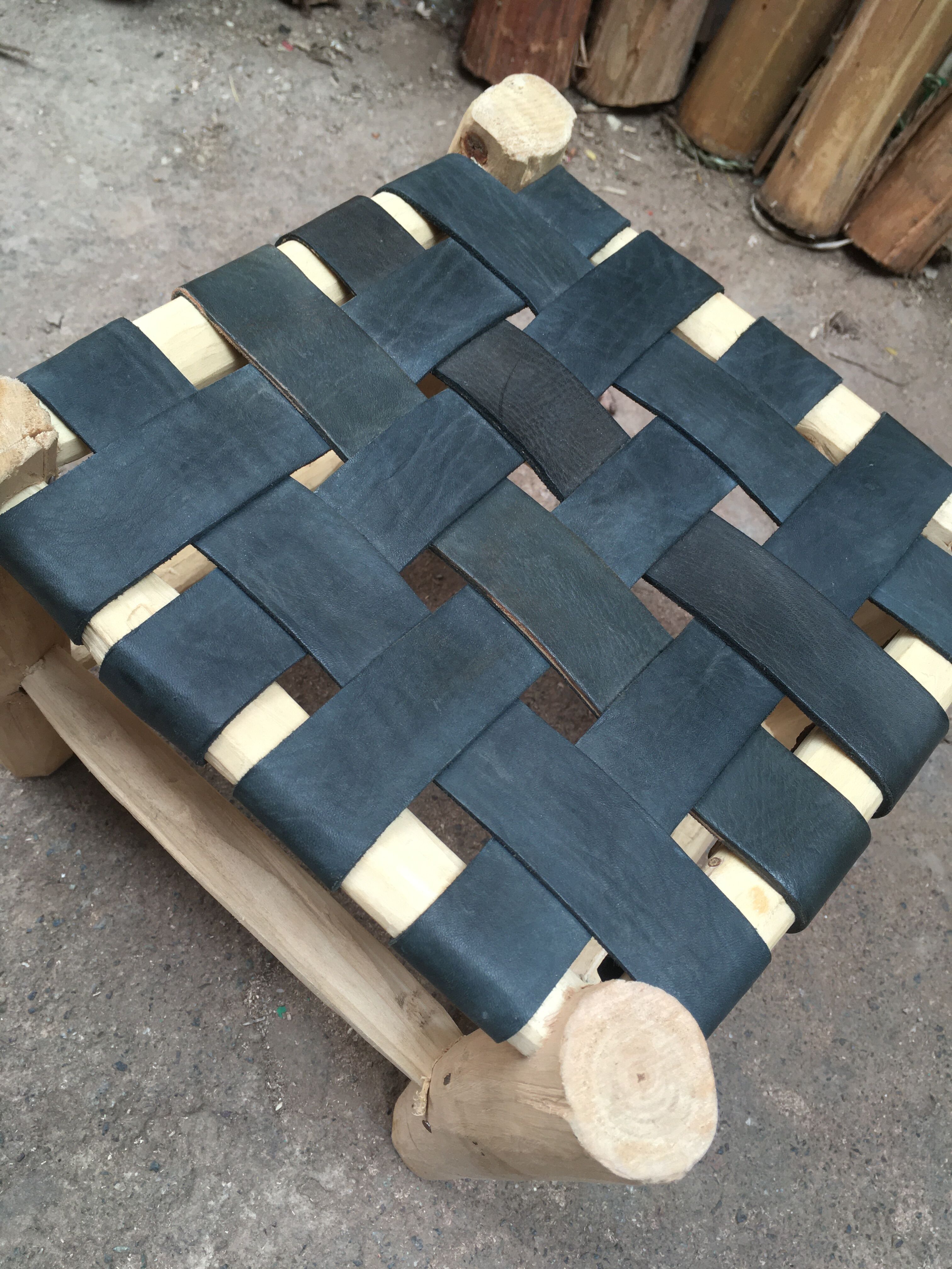 Set of four traditional moroccan stools in black leather and raw wood