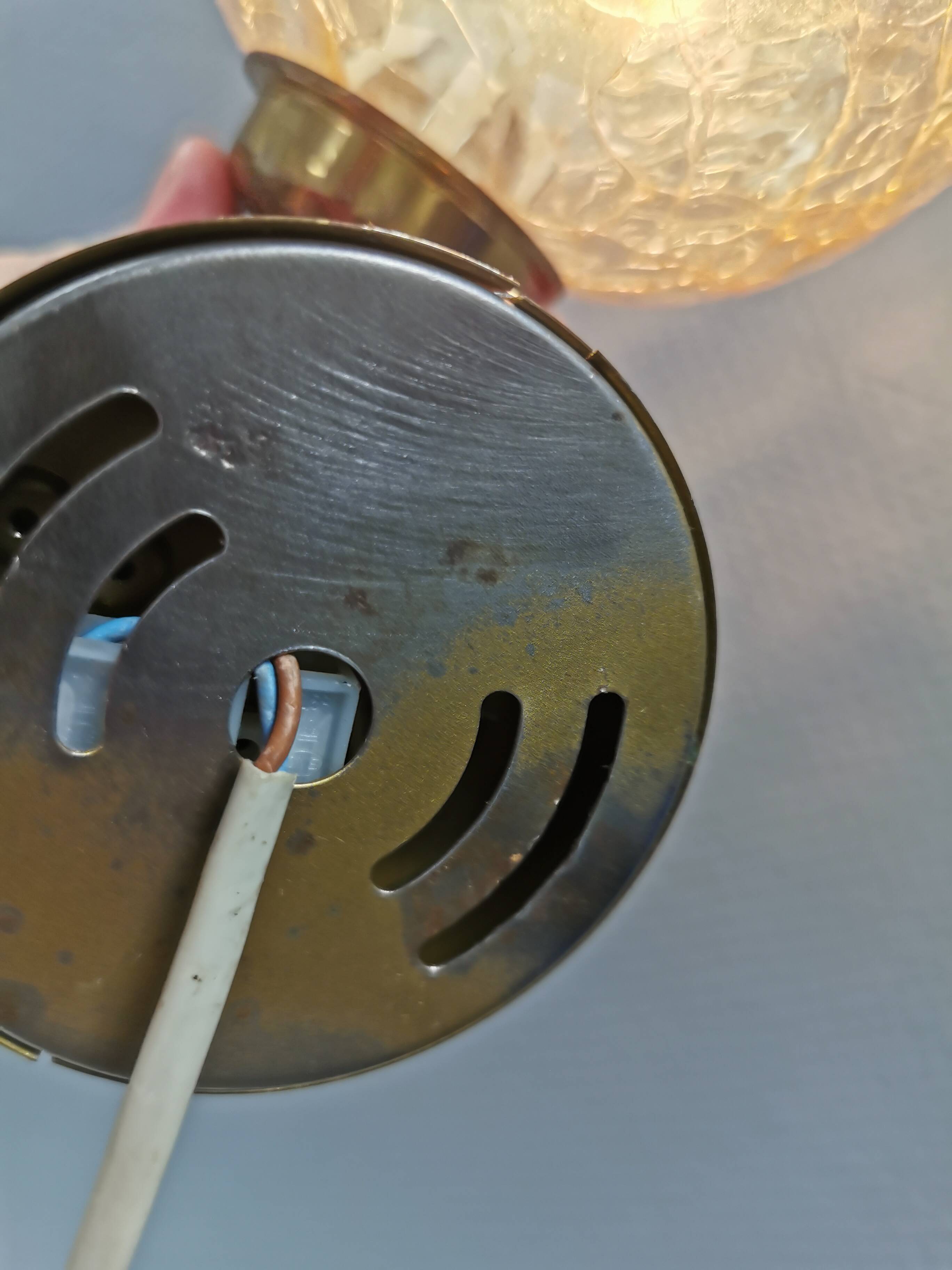 Older wall lamp in metal, brass and “cracked” glass.