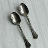 2 porcelain cups with metal supports and small spoons.