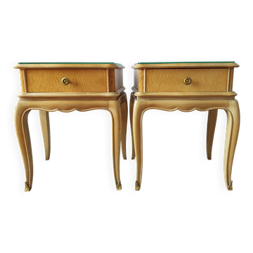 Pair of French bedside tables in the style of Jean Pascaud.