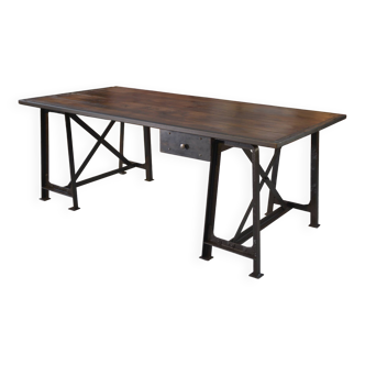 Industrial desk on riveted steel trestles and circled pine top