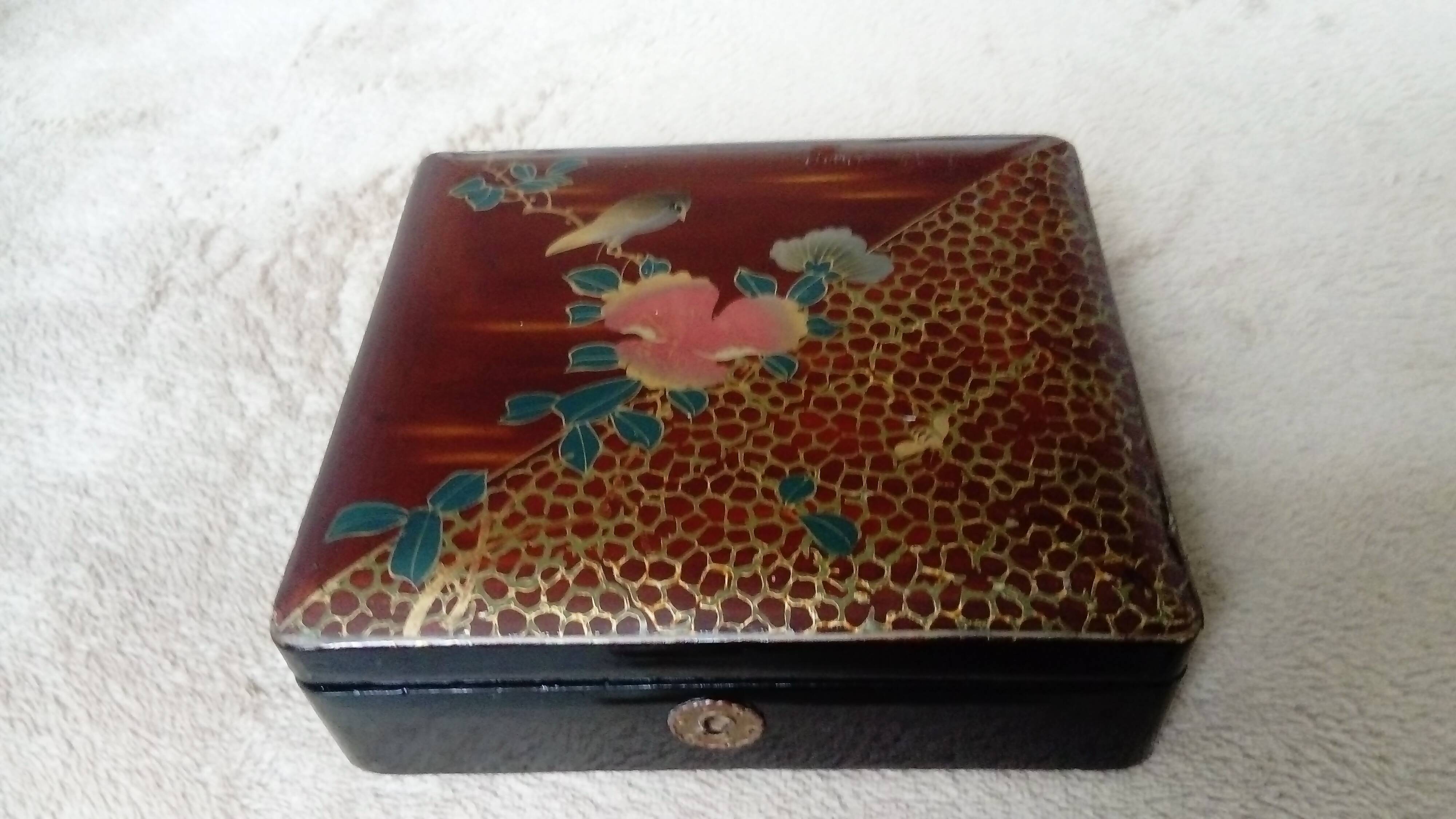 Old lacquered jewelry box with Asian decoration bird, flower, bee