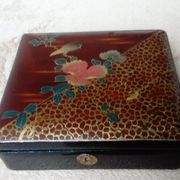 Old lacquered jewelry box with Asian decoration bird, flower, bee