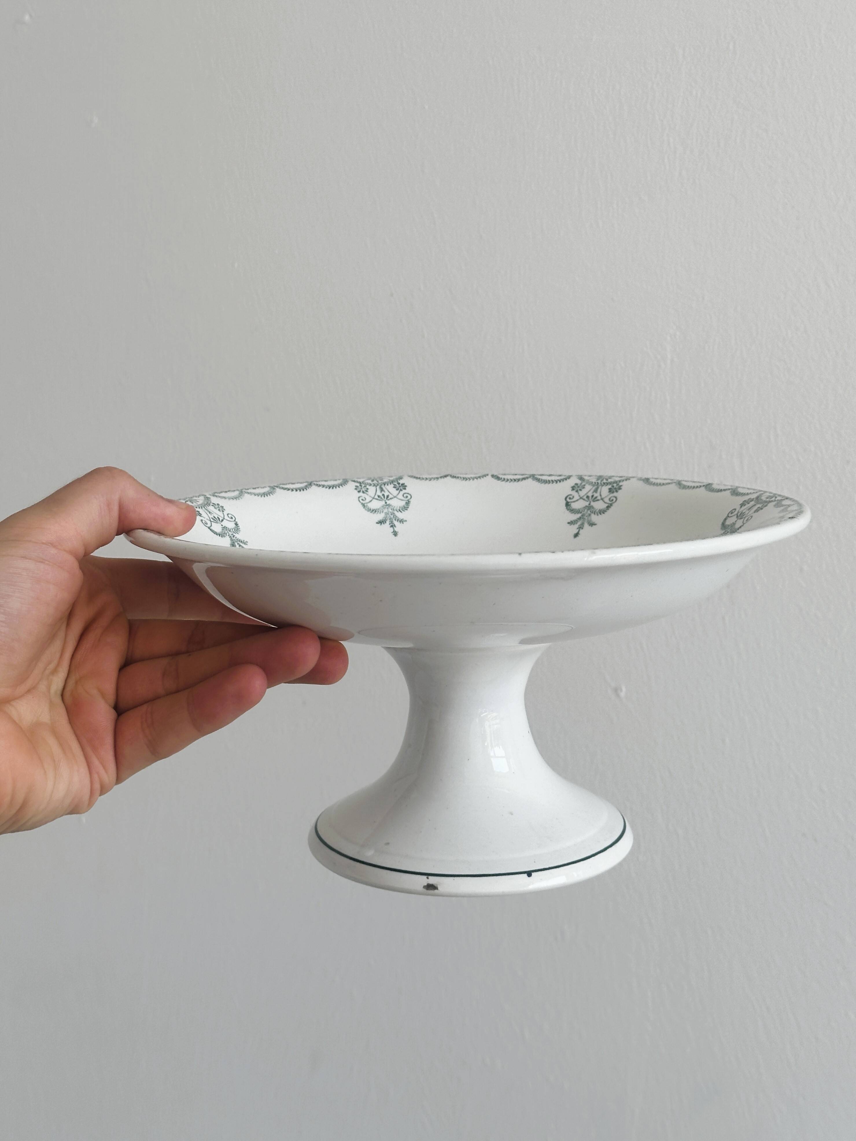 Earthenware fruit bowl on foot