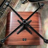 Black leather Eames Vitra armchair, original with rosewood ottoman.