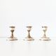 Lot of old candlesticks in brass and mother-of-pearl