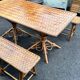 Vintage 1950s set: large table with tripod base and benches in woven chestnut